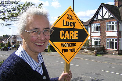 Lucy Care with a garden poster