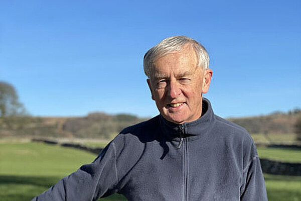 Portrait picture of Robert Court in the Derbyshire countryside