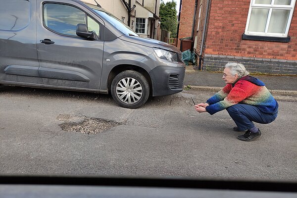 Lucy Care reporting a pothole