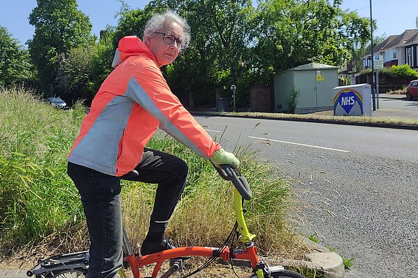 Lucy Care on her bicycle